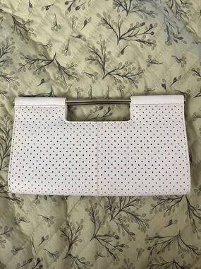 The Limited White Perforated Clutch with Metal Handle